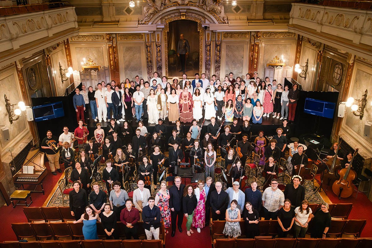 Group photo from above of participants from the 2025 Nights Young Artists Music Festival at the Haus der Industrie in Vienna.