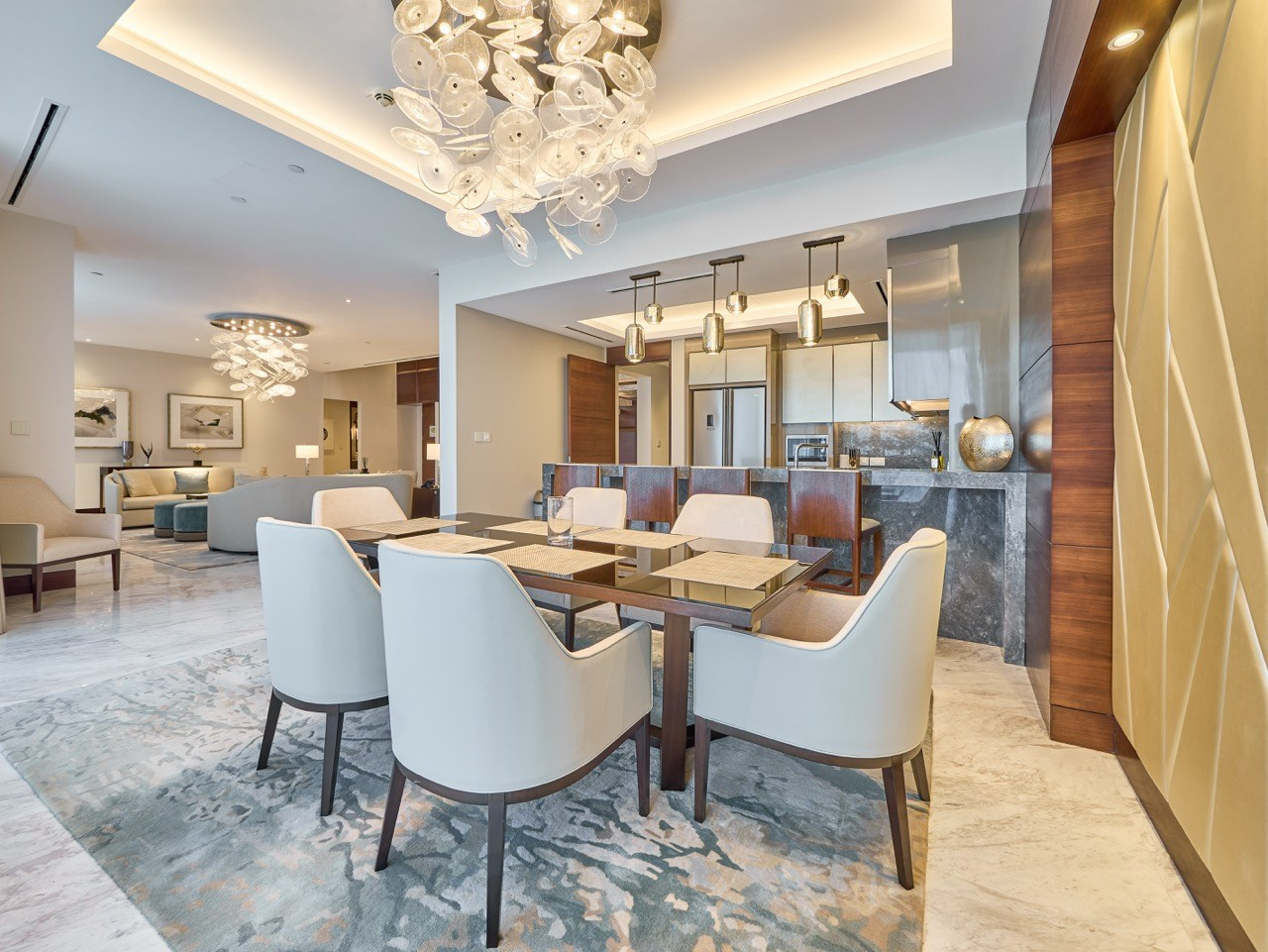 Dining room with chandelier and wood accent walls, by boutique hotel photographer.