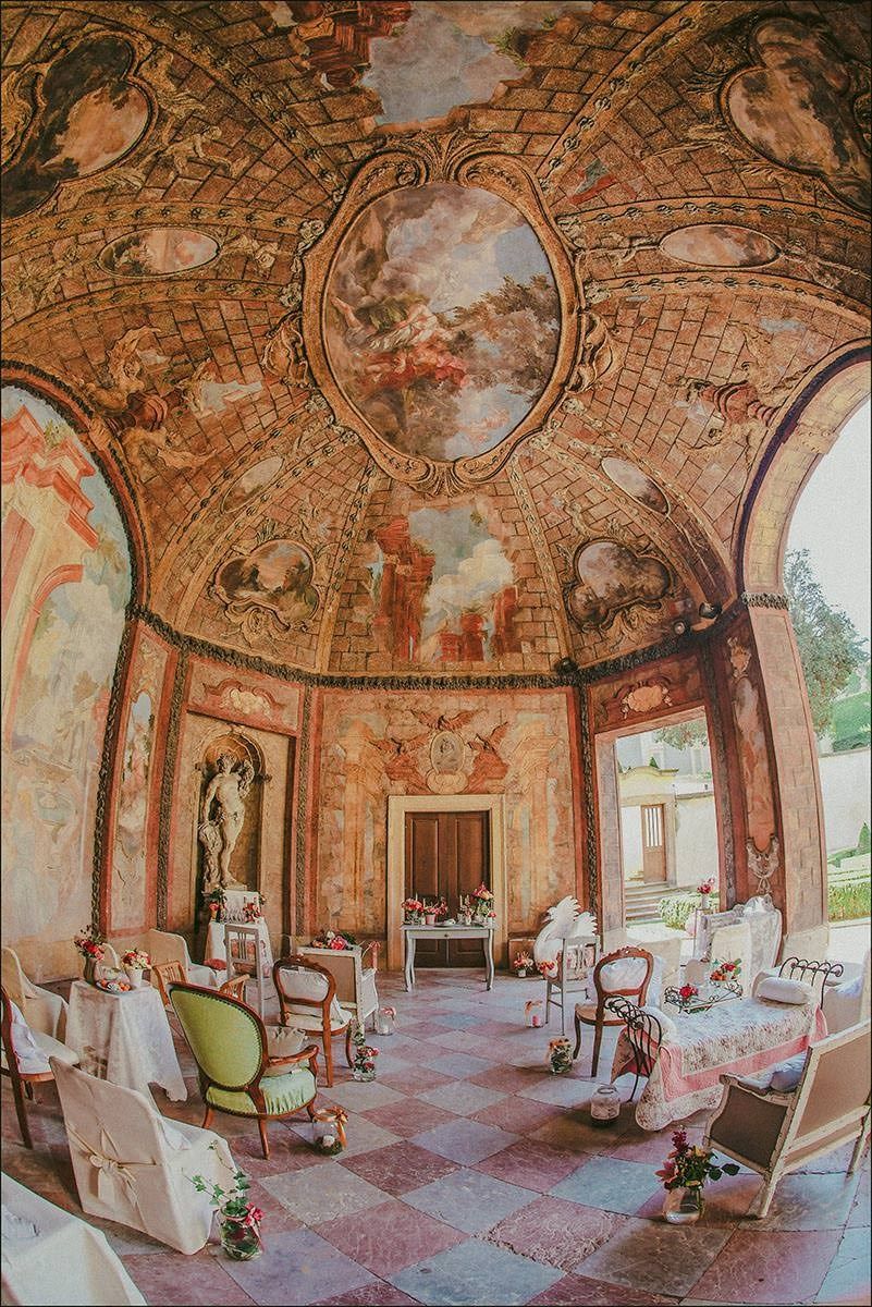 Historic Sala Terrena at Vrtba Garden was transformed with a lush floral design by the bride, Michelle, for her Prague wedding