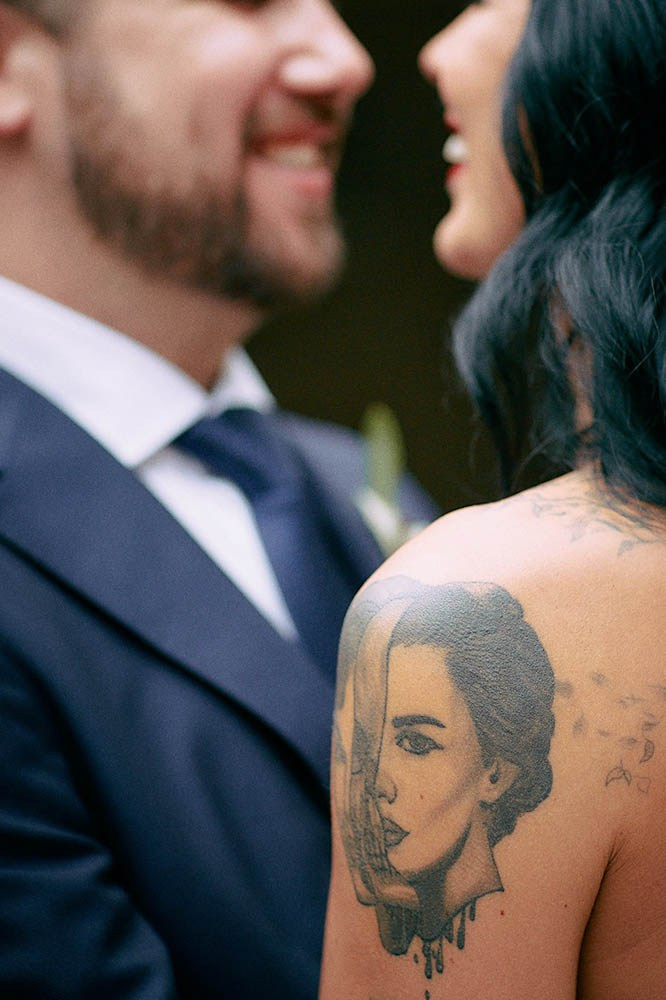 Detailed close-up of the burlesque bride's distinctive tattoos.