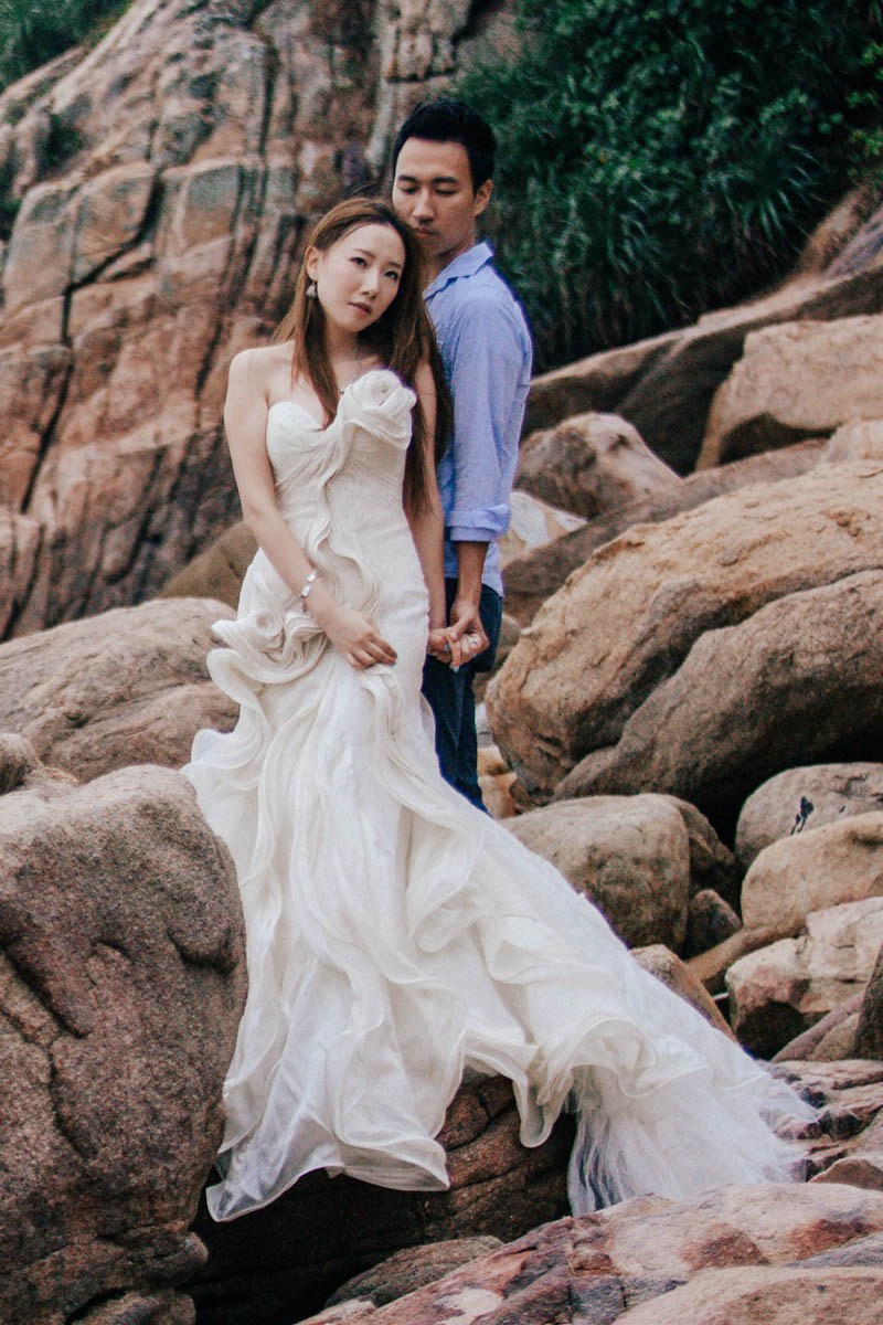 Bride in a Packham designer dress and her groom at a beach in Shek O, outside of Hong Kong - Kurt Vinion Engagement Photographer Prague