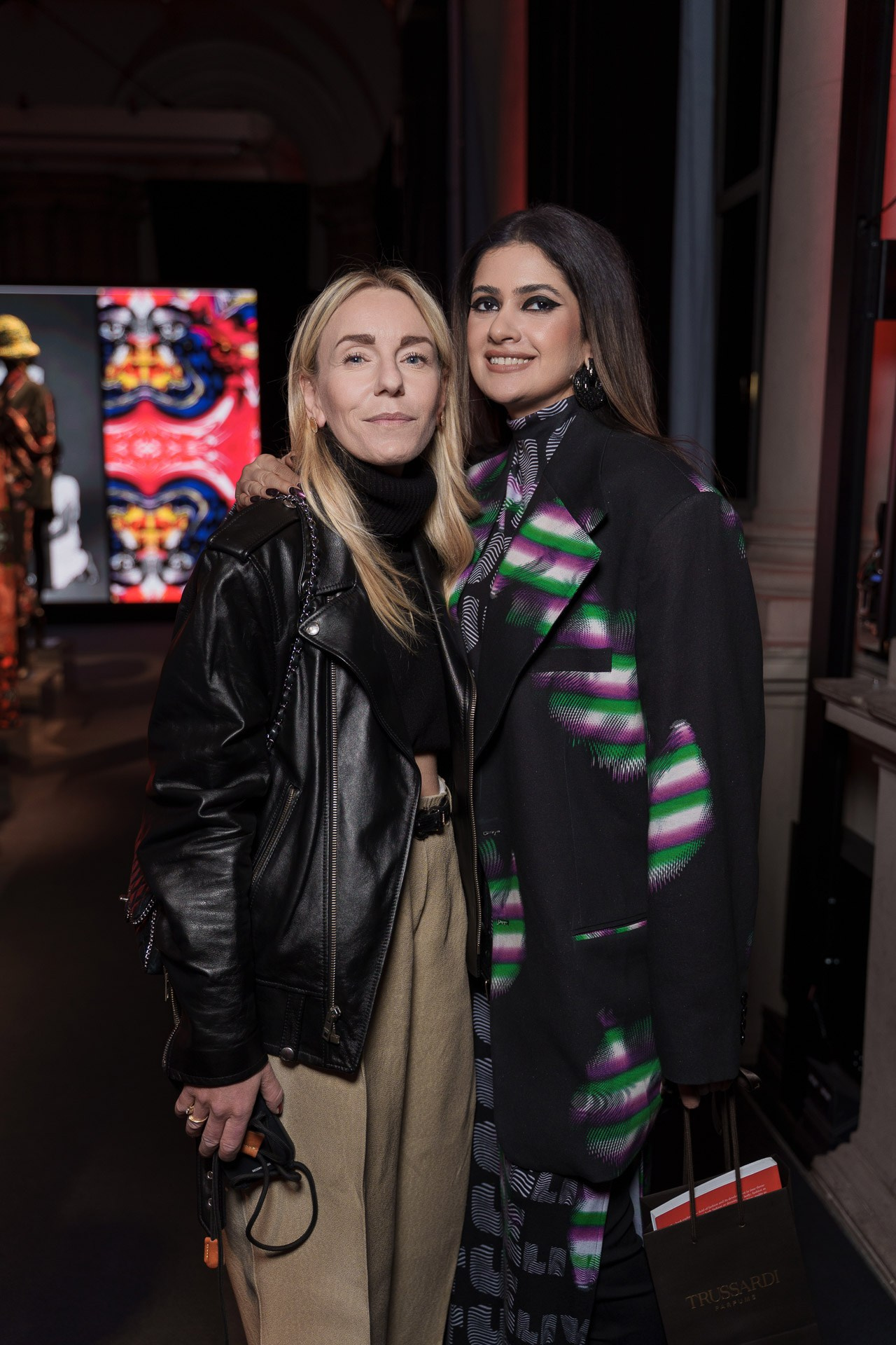 Elegant guests portrait at a corporate event in Milan, captured by a professional event photographer during a fashion industry reception.