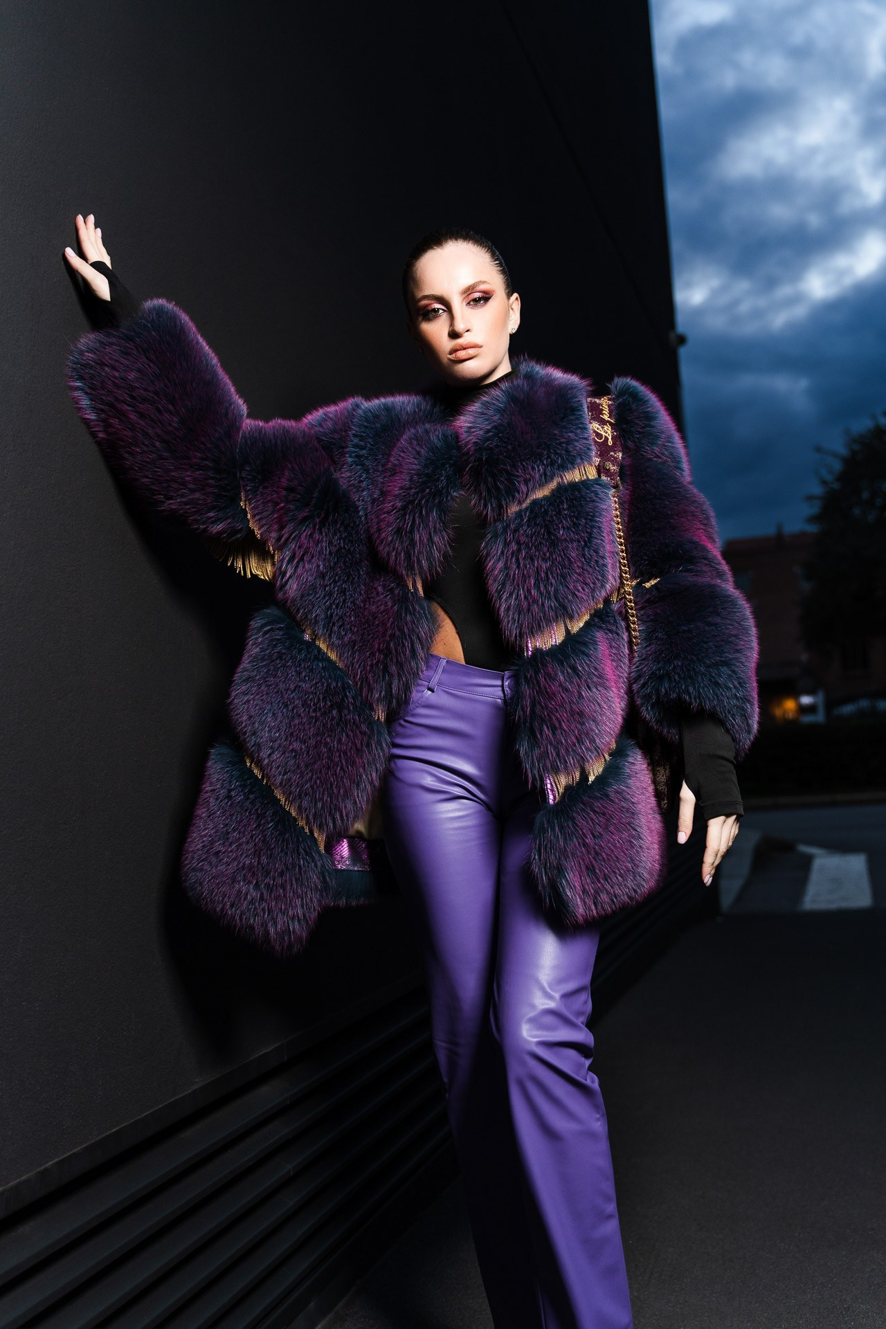 Fashion portrait with bold styling and dramatic pose, creative editorial look