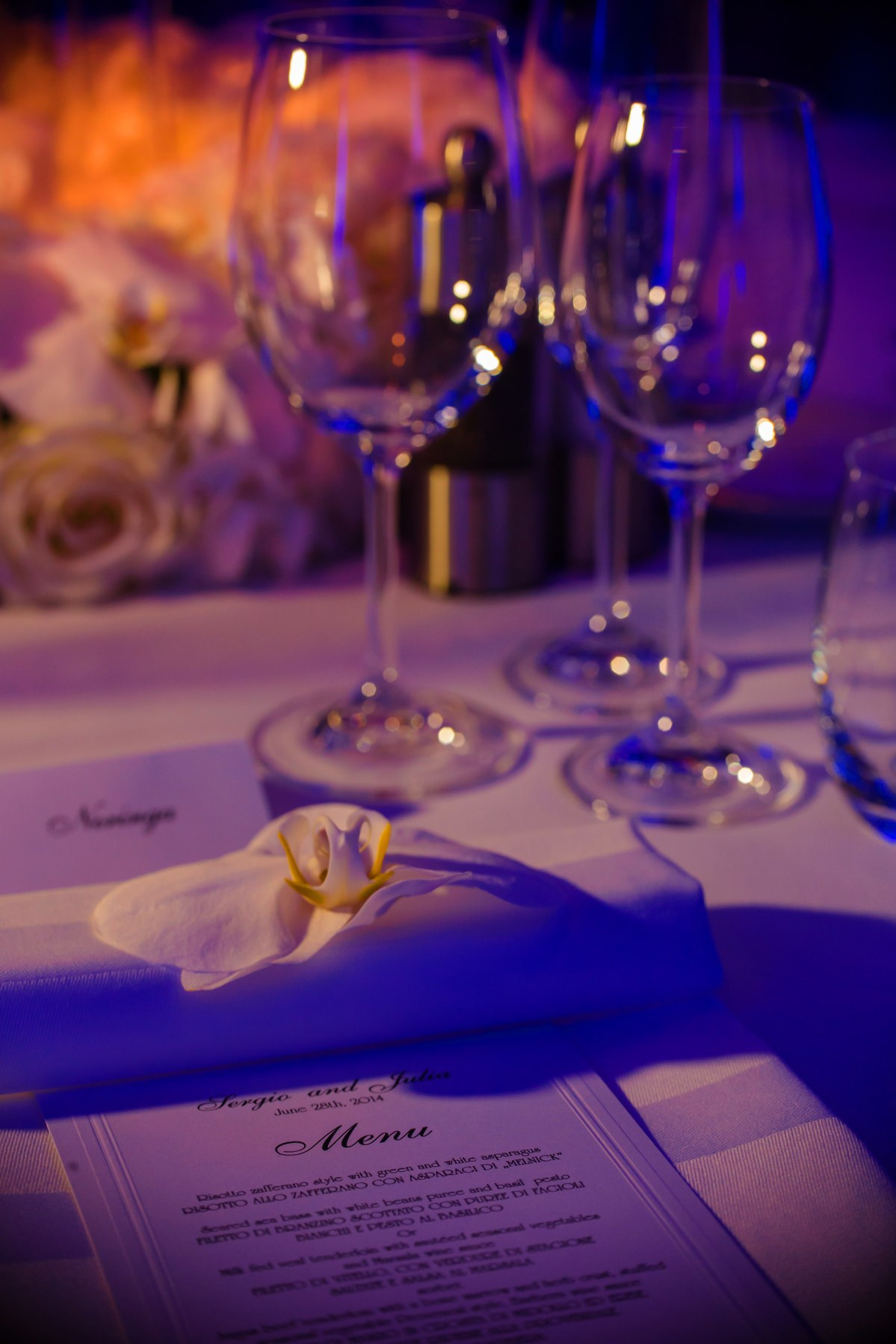 Sophisticated table decor in blues purples and orange Four Seasons wedding Prague