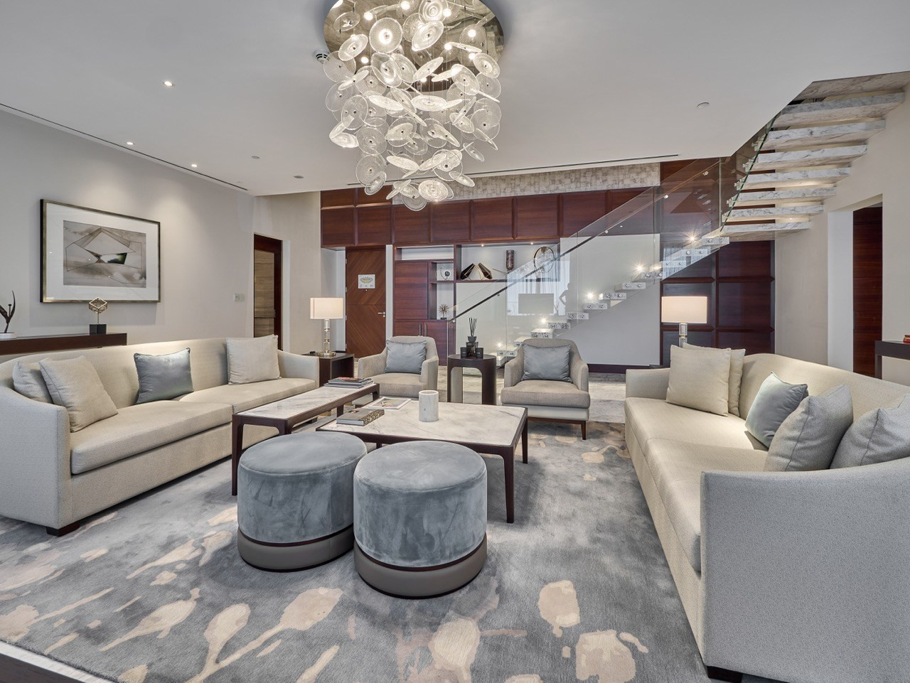 Modern living room with neutral tones and center table, vacation rental photographer.