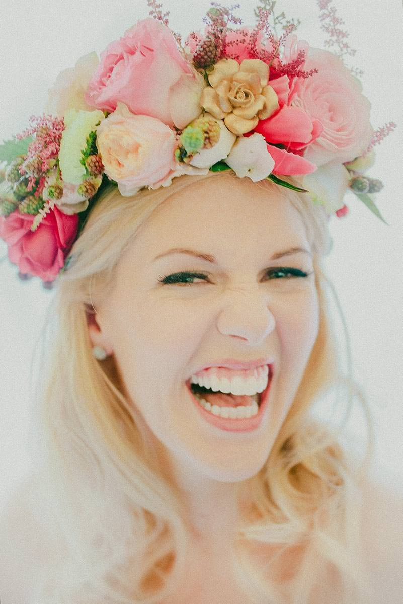 Happy bride Michelle laughing during her wedding preparations