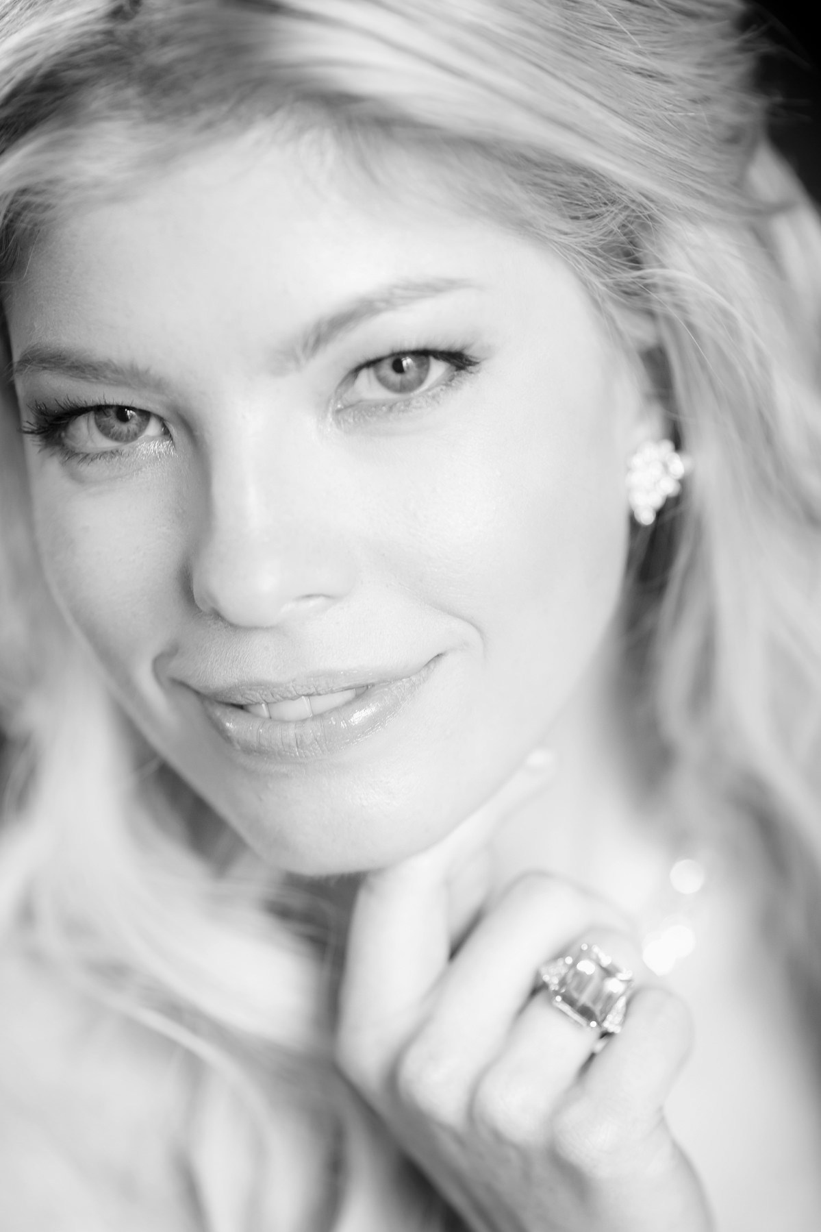 Black and white close-up of smiling bride Julia gazing at camera Prague wedding