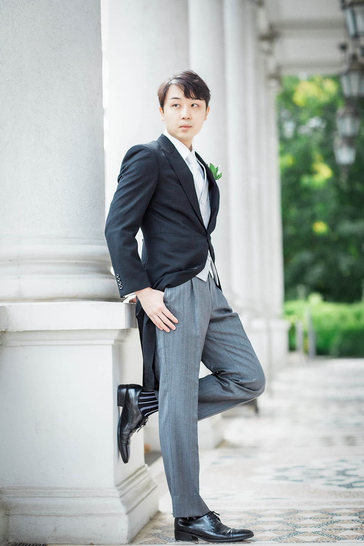 Groom portrait on balcony at Palais Coburg Vienna.