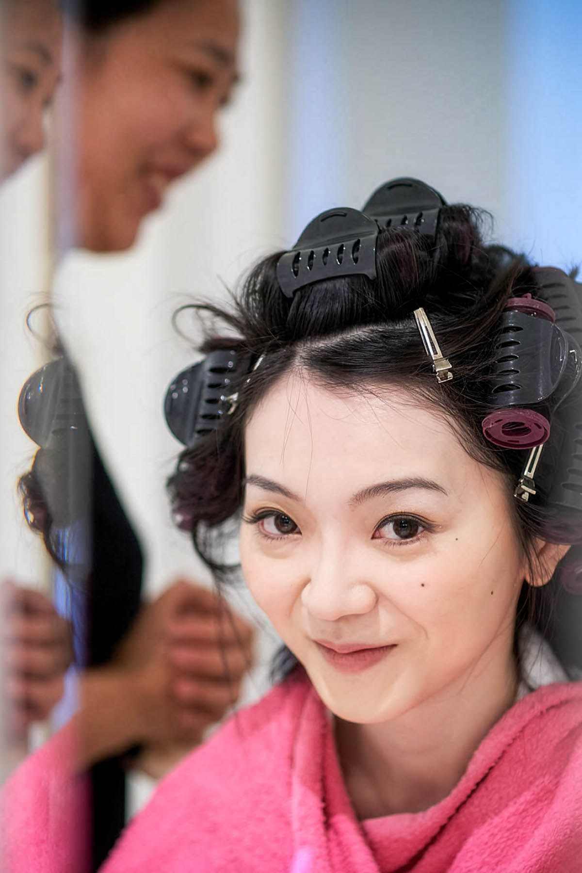 A nervous bride smiles.