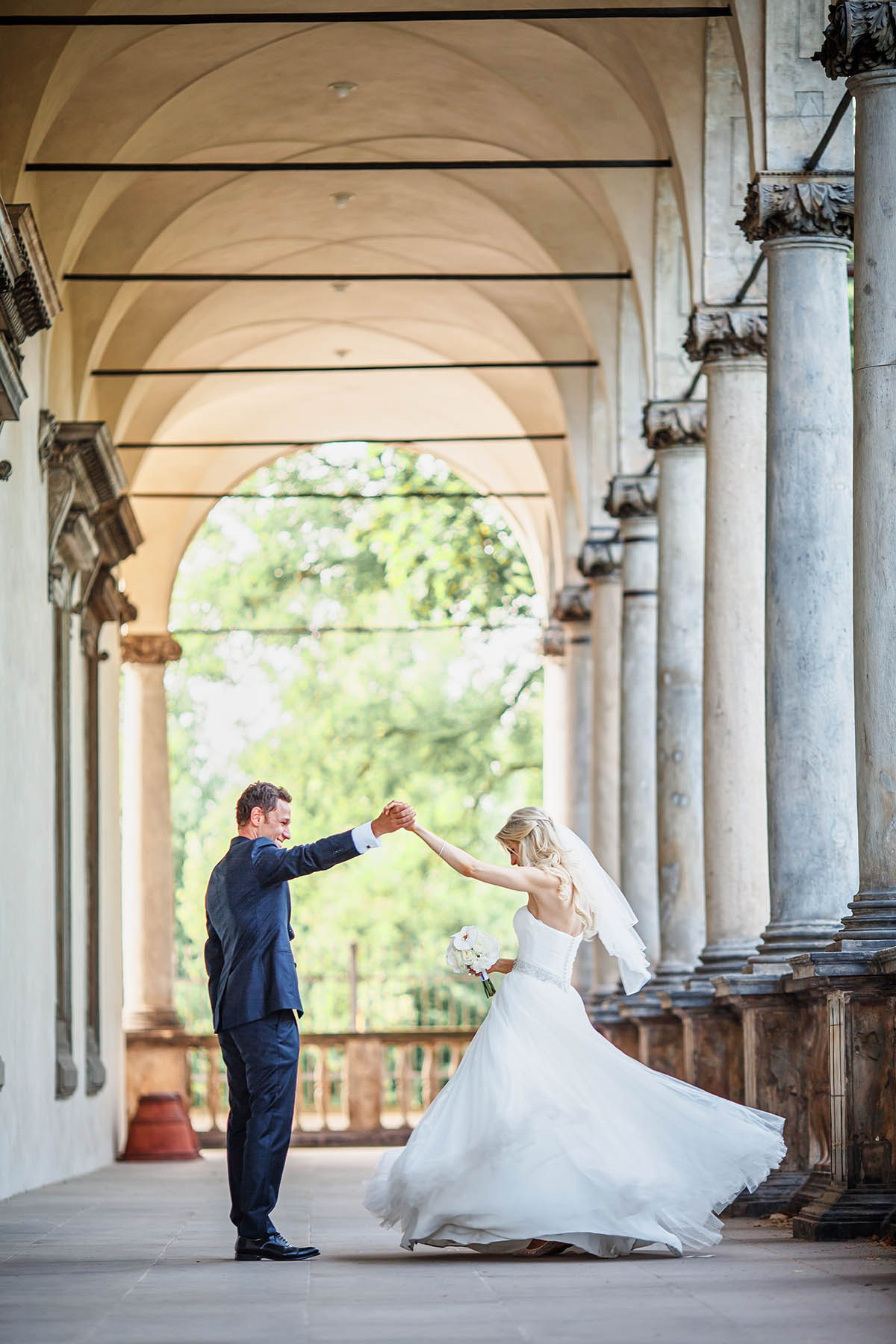 Groom dancing with bride at Queen Anne's Summer Palace Belvedere Prague