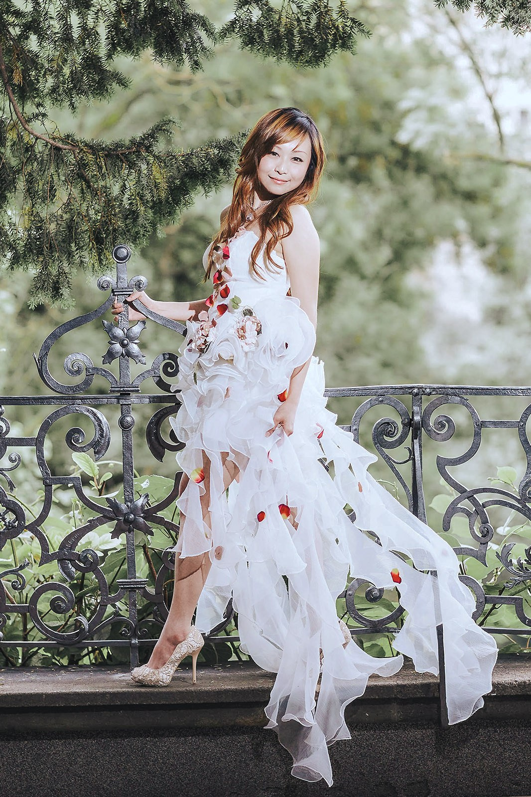 The gorgeous Hong Kong bride posing in her designer wedding dress near the Belvedere, Prague Castle.