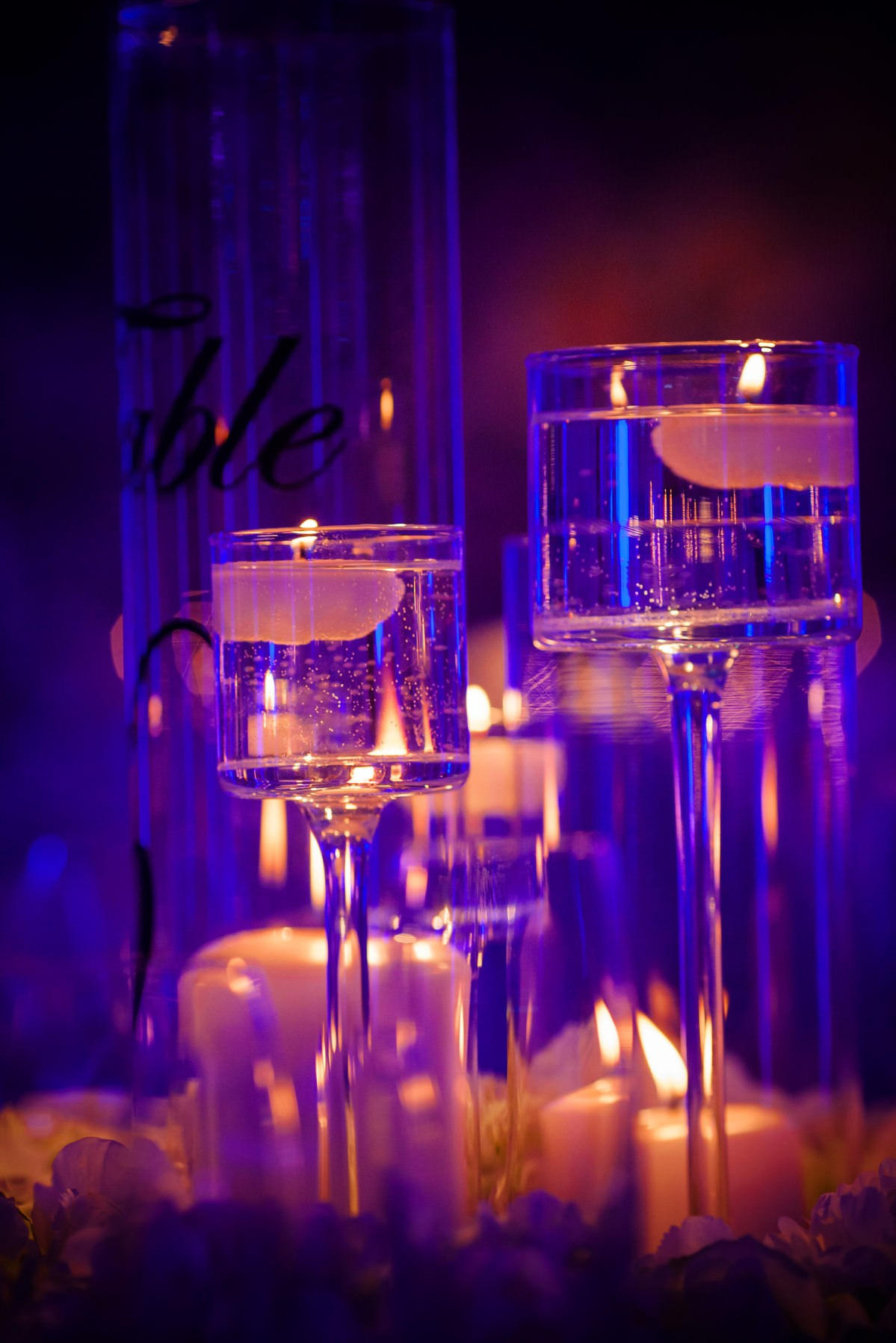 Candles against rich blue purple interior Four Seasons wedding Prague