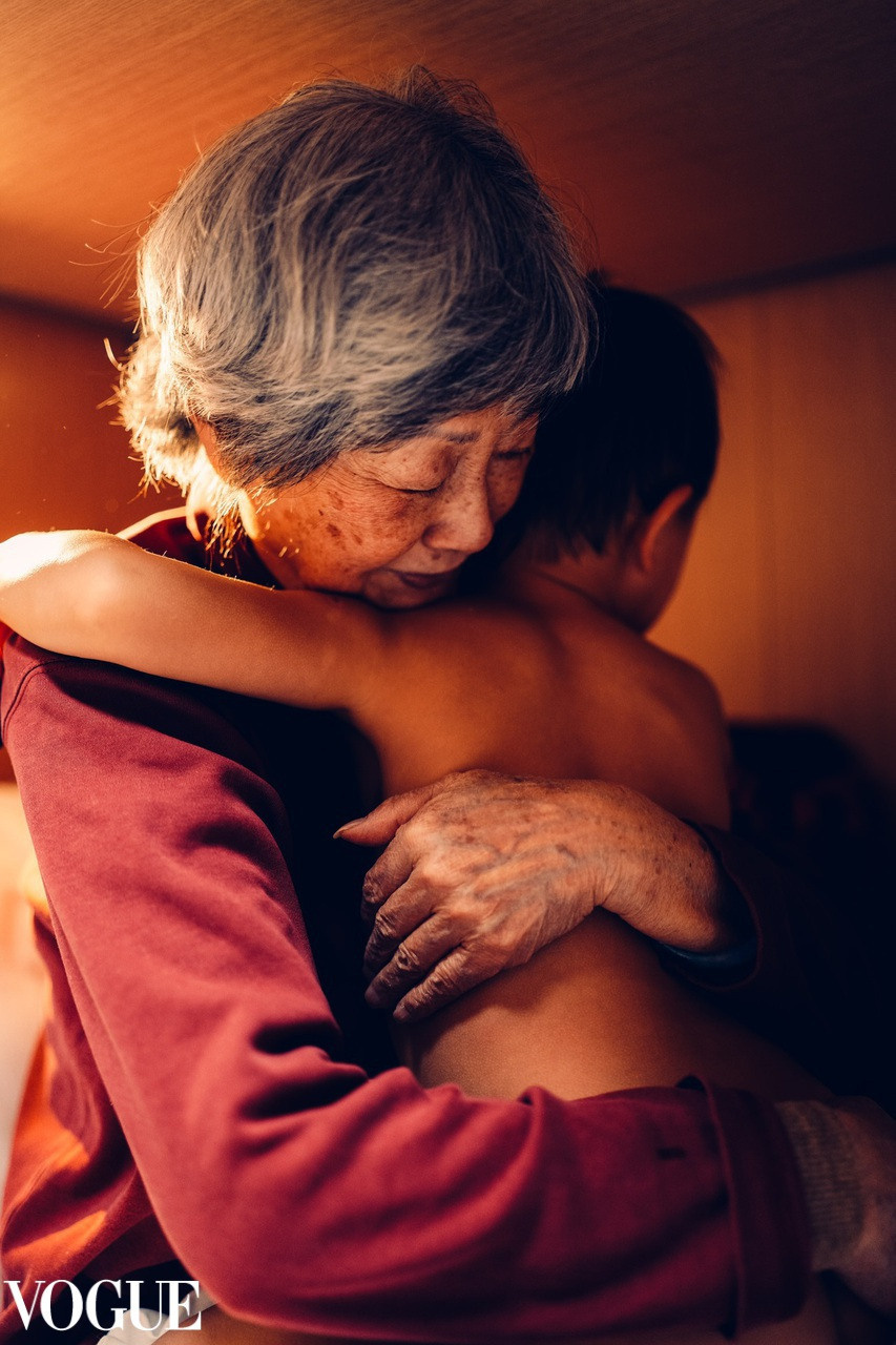 Granma is hugging her grandson. VOGUE Irina Zoteeva, kids and newborn photographer. Solihull newborn photographer. Newborn photographer near me.