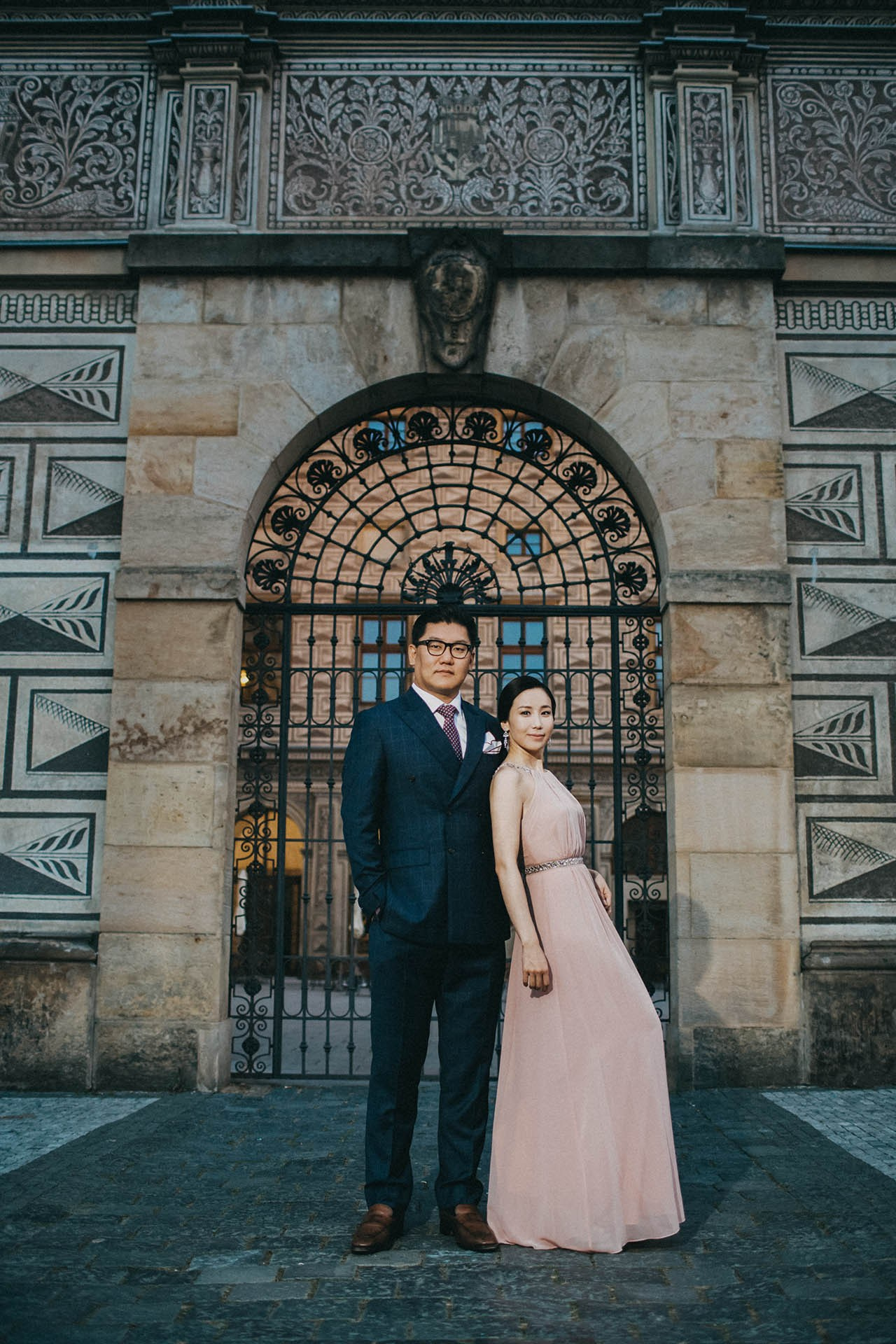 Catherine Cedric Son doorway evening wear Prague Castle portrait.