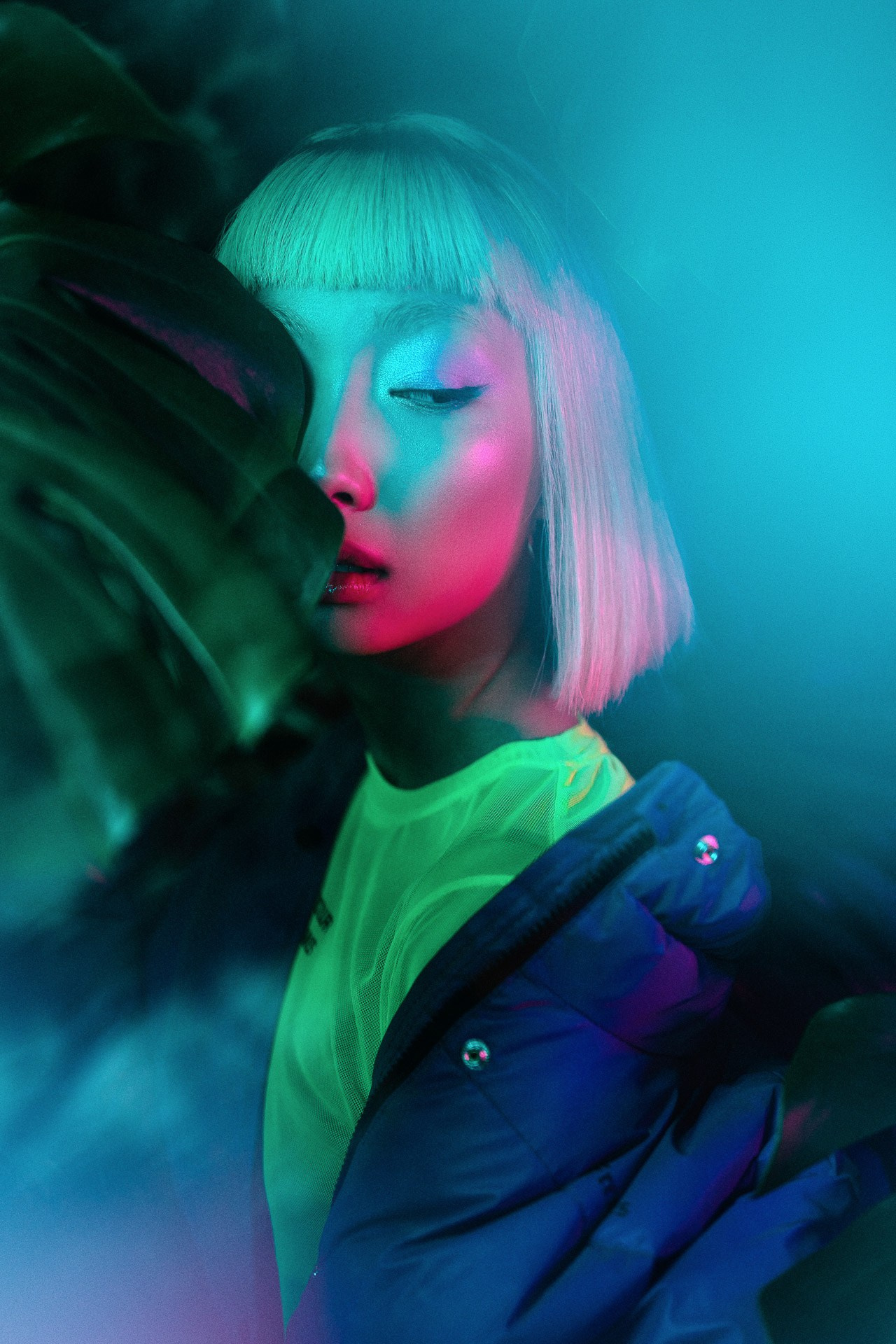 Neon portrait photography in Milan with colorful studio lighting for fashion and commercial campaign