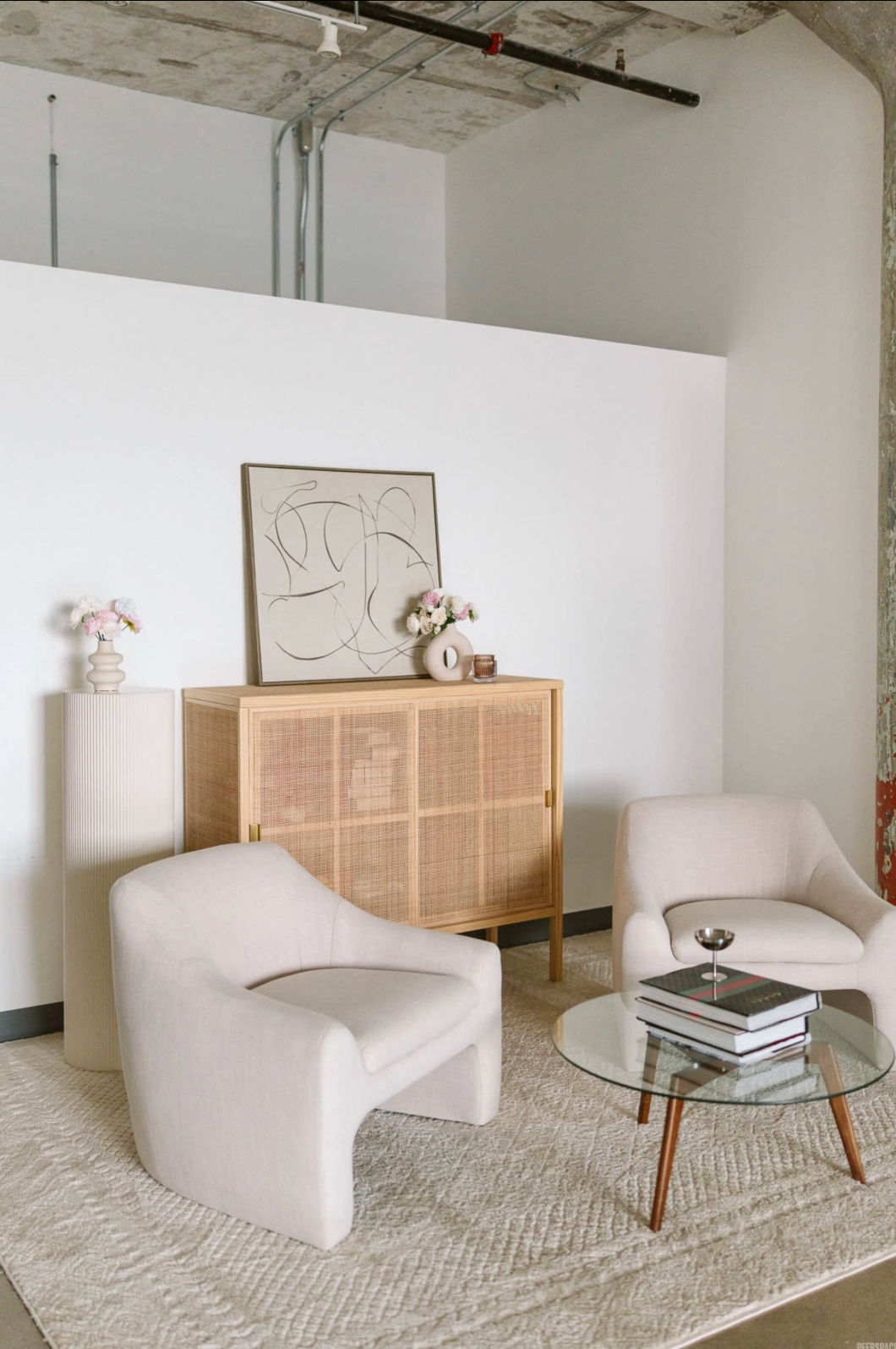 Elegant studio setup with fresh flowers and soft pastel tones