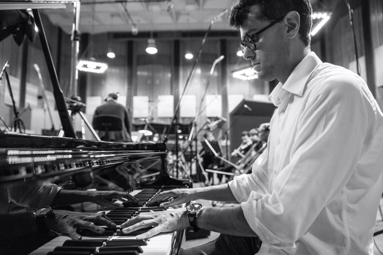 Professional event pianist performing live at a corporate gala in Milan, captured by an event photographer