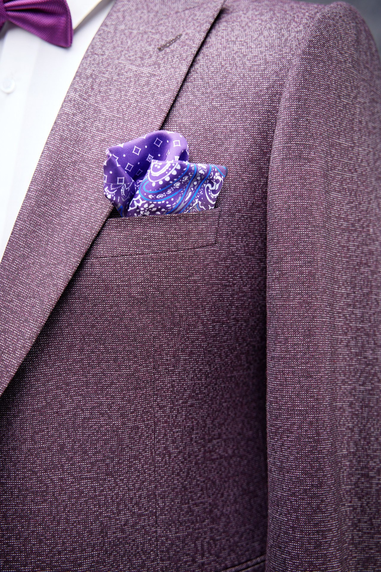 Detail shot of tailored jacket with pocket square, menswear photography