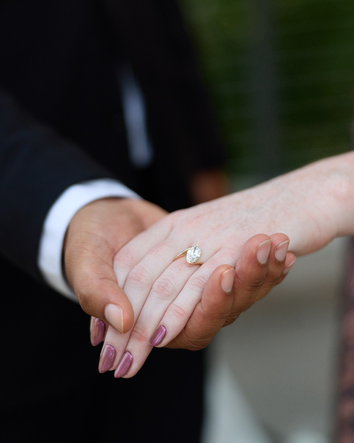 Macro of the engagement ring on her finger in Dublin, Ohio