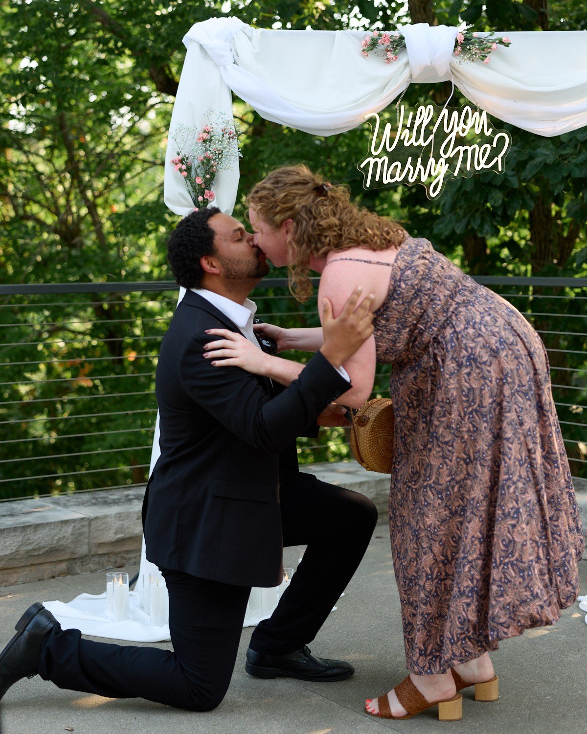 Kiss under the "Will you marry me?" arch on the Dublin Link Bridge in Ohio