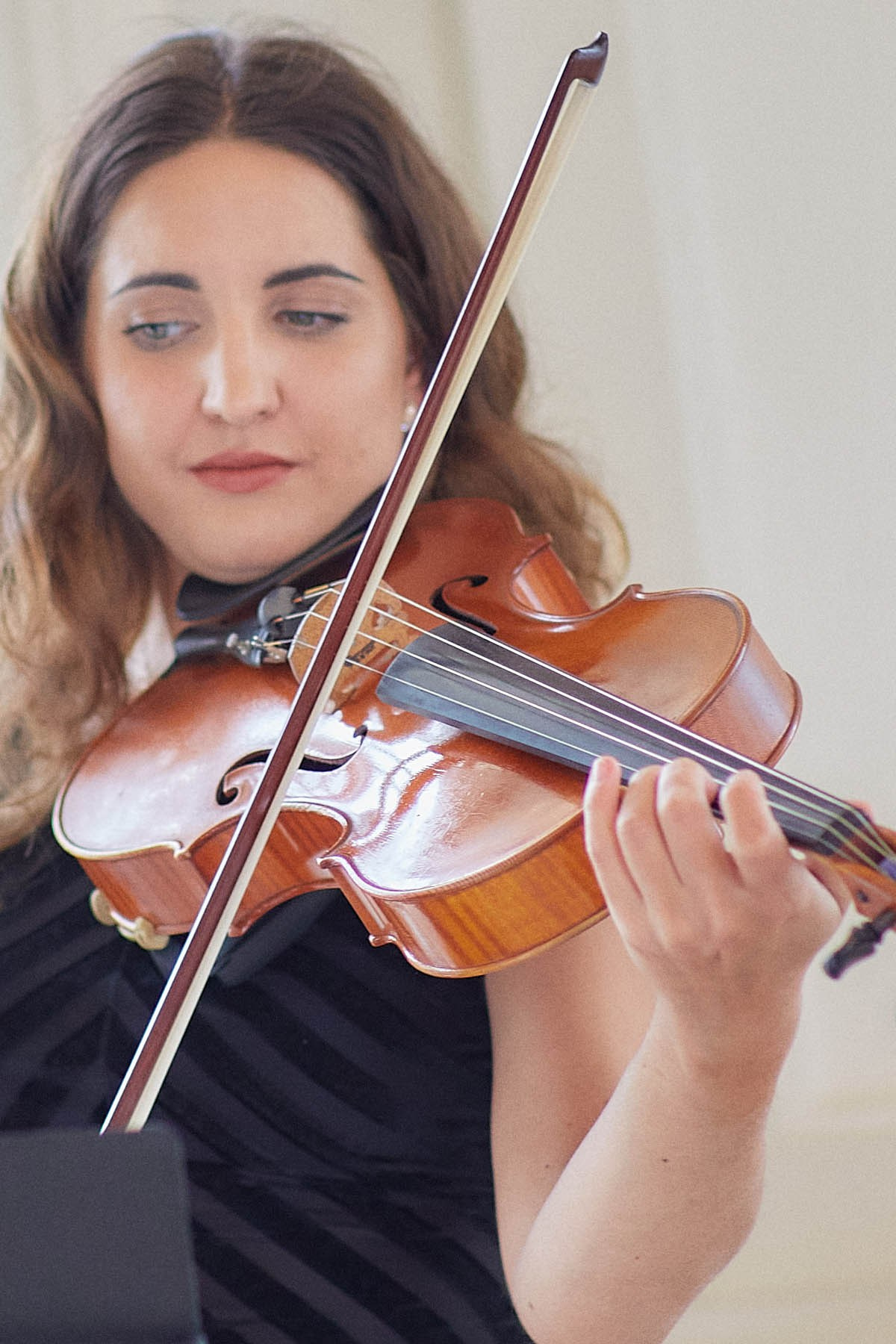 The violinist performs during the ceremony.