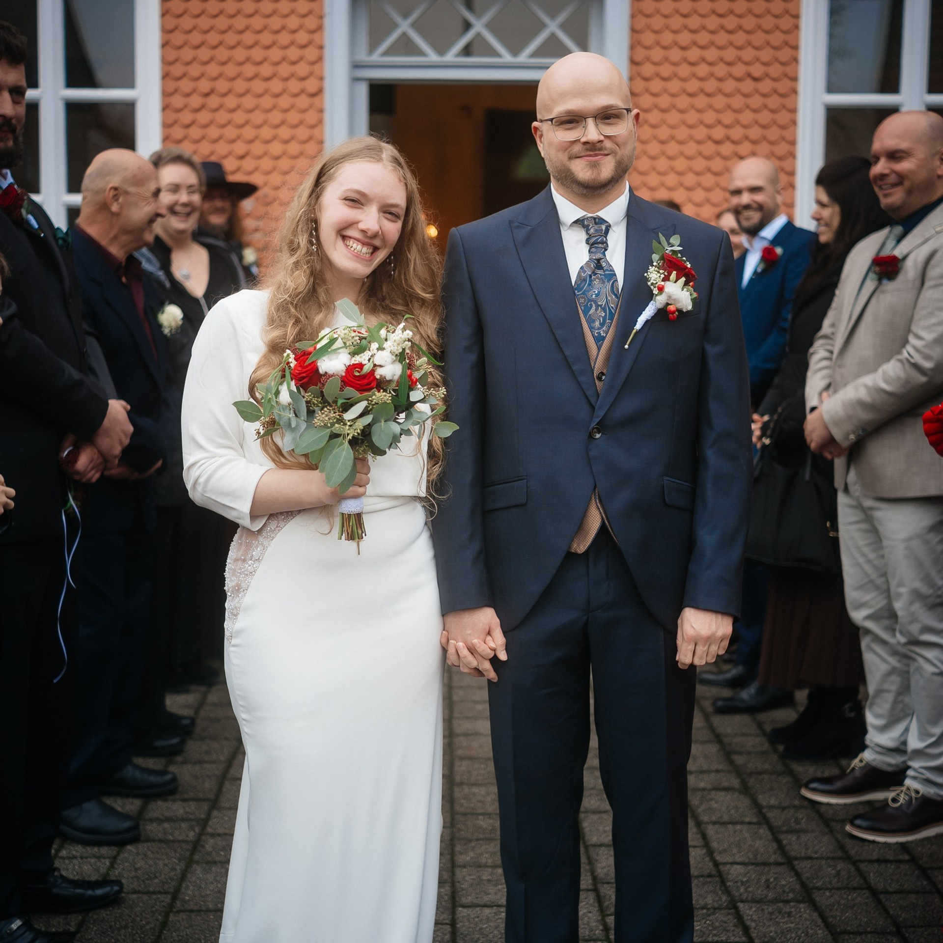 Bride and groom coming out to reception after ceremony