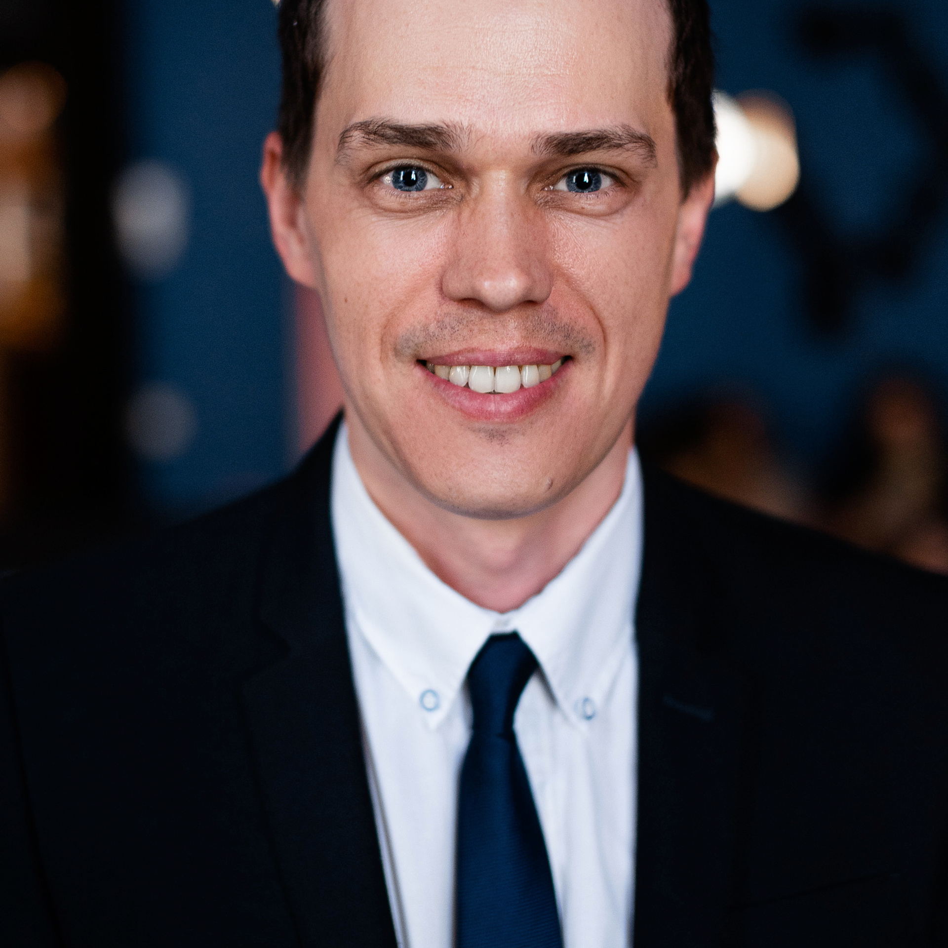 Confident business professional portrait by Dmitrii Shmatov for use in resumes and job applications.