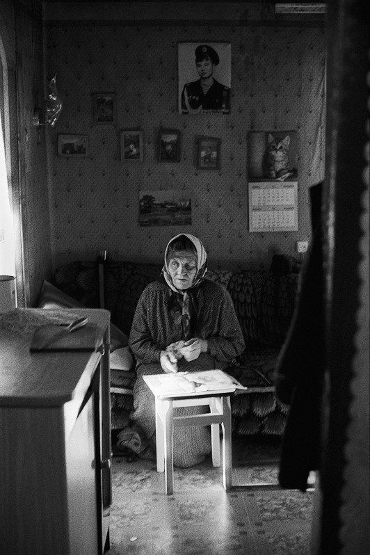 Against the background of a photo with his grandson, Senshin khutor, Oblivsky district, Rostov-on-Don region, Russia. May 2011