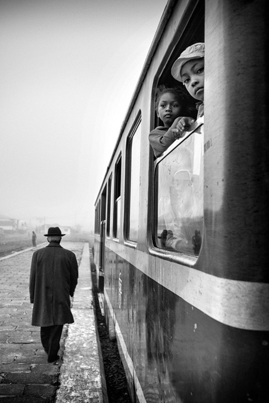 Grandad on the platform. The holidays are over, Fianarantsoa, Republic of Madagascar. 2015