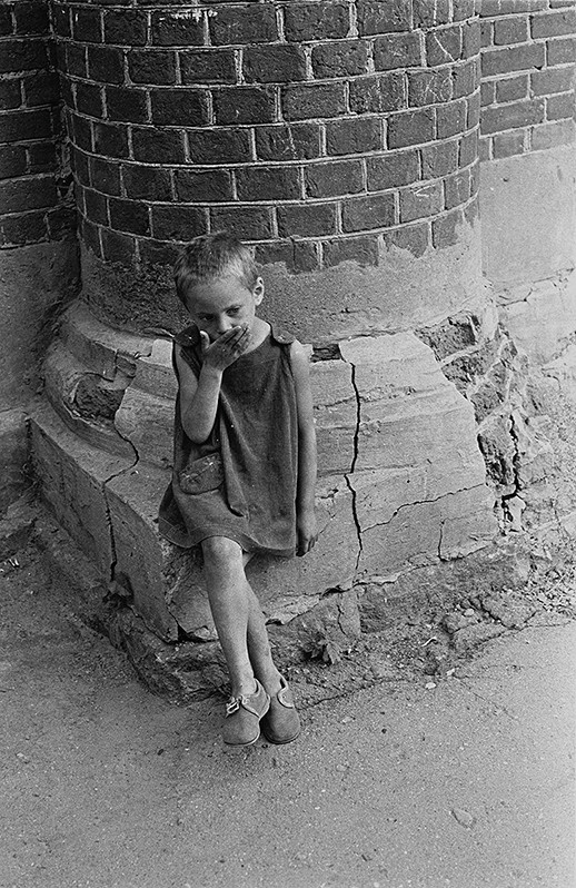 Girl against the wall, Kirillov, Vologda Region, Russian SFSR. July 1984