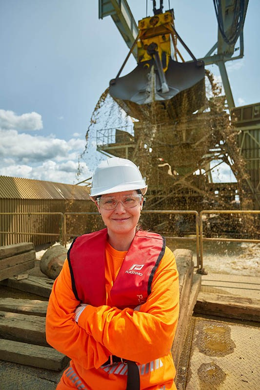 Portrait of a woman on a dredging machine in the Czech Republic.