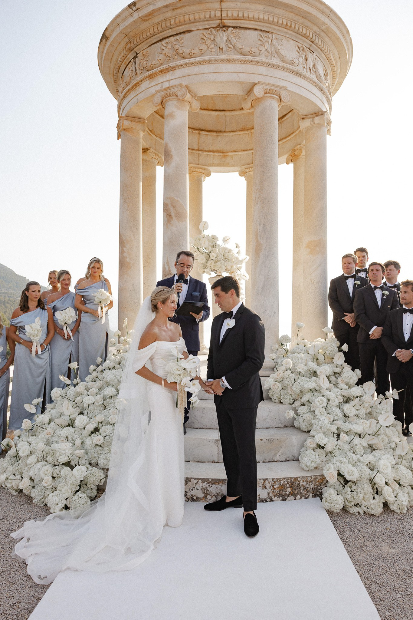 Bride and groom holding hands during their vow exchange at their Son Marroig wedding ceremony