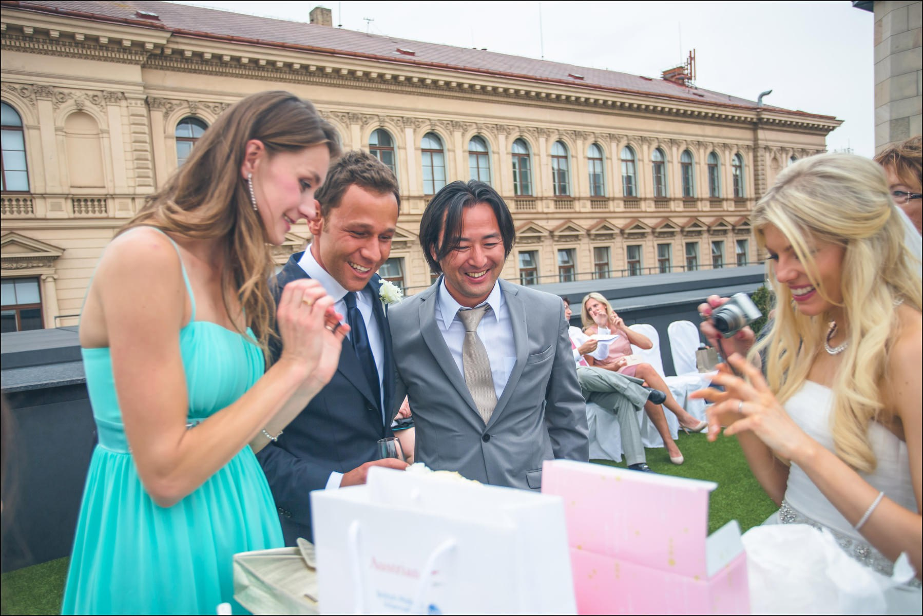 Bride and groom near gift table rooftop reception Four Seasons Prague