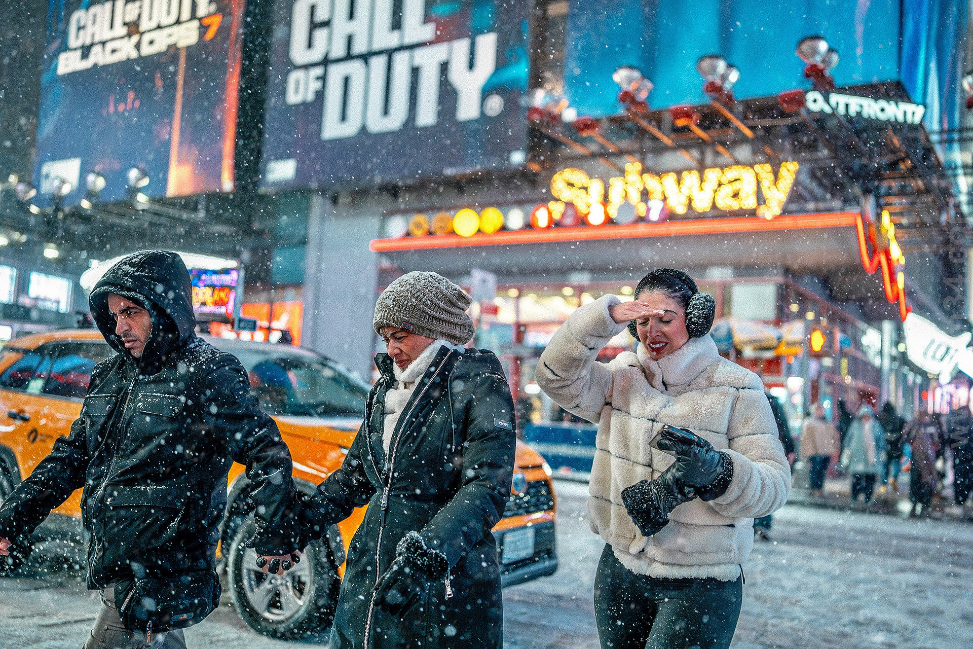 New York City Snowfall Street Photography — Night Winter Scenes Capturing Emotions, Reactions & Euphoria of Falling Snow. Emin Kuliyev — Award-Winning Wedding Photojournalist NYC & USA | Best Wedding Photographer Known for Candid, Timeless Moments