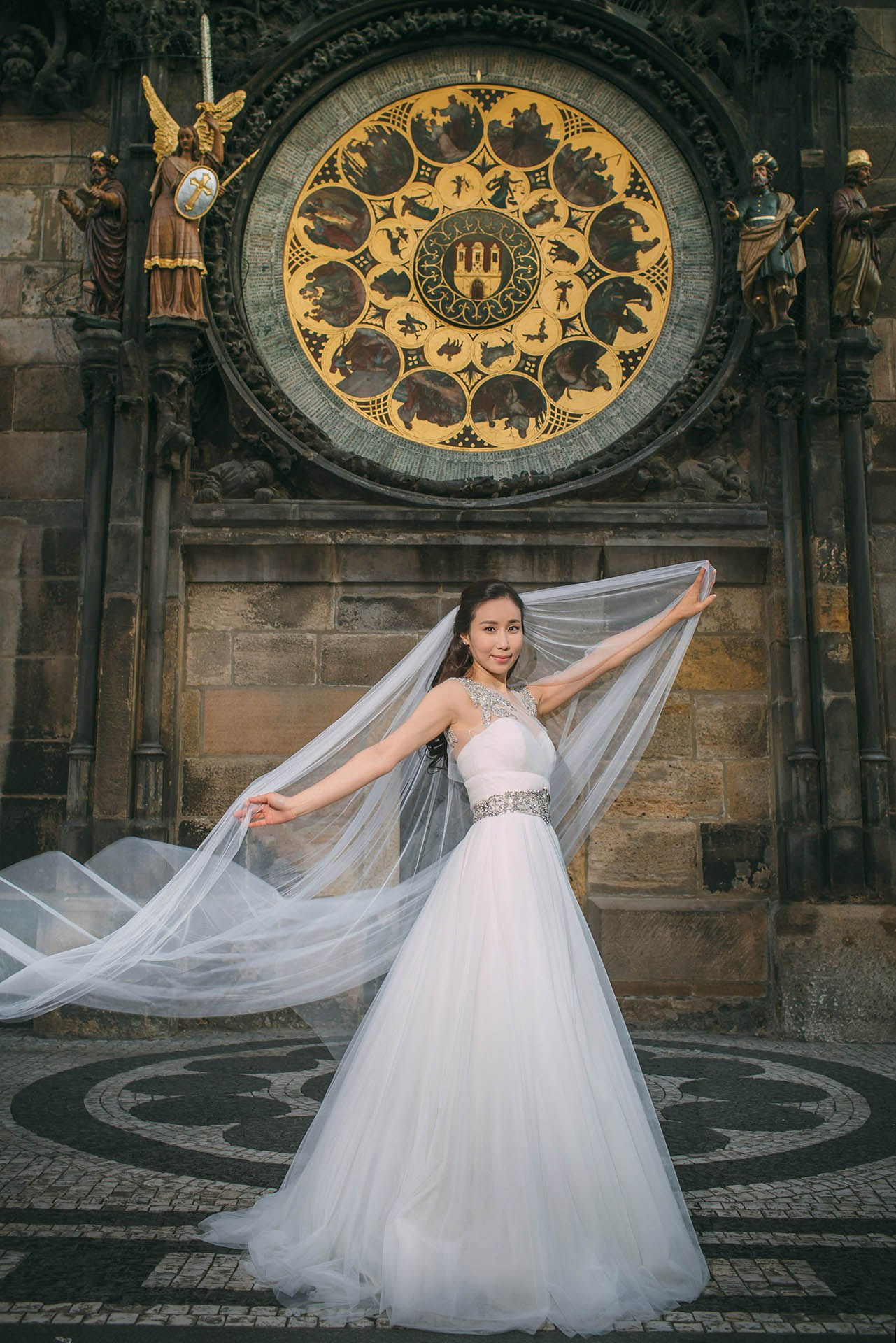Catherine wedding dress veil Astronomical Clock Prague portrait.