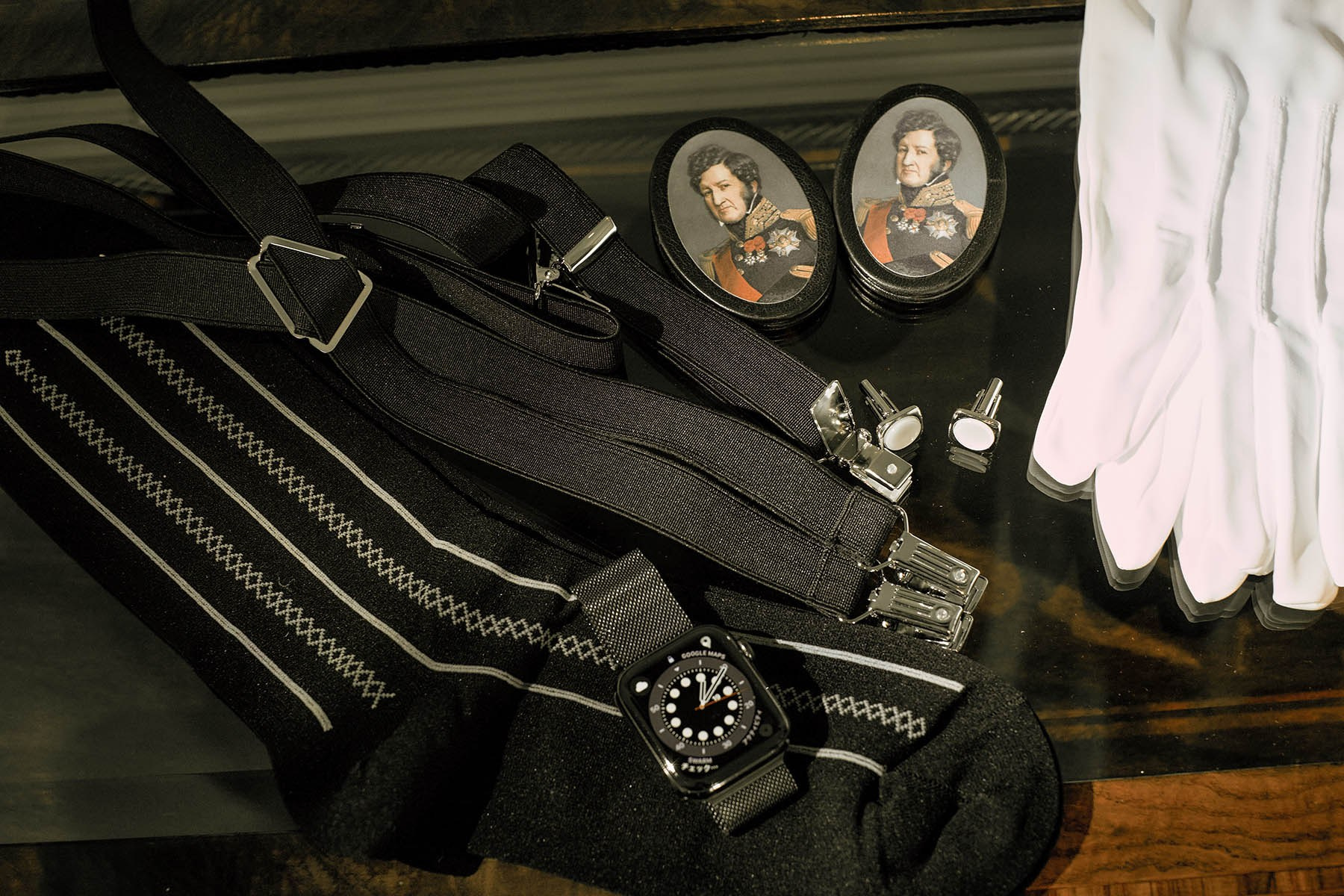 Suspenders, watch, and white gloves add a touch of class for the Japanese groom Katsuya.