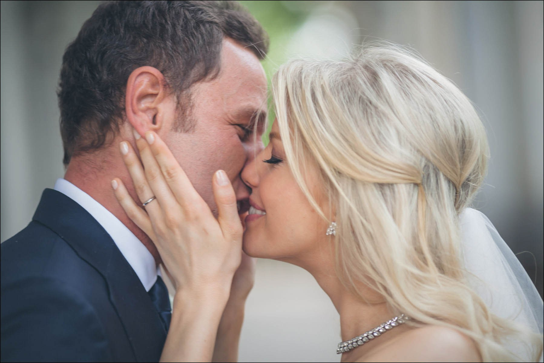 Close-up of newlyweds kissing during romantic Prague portrait session