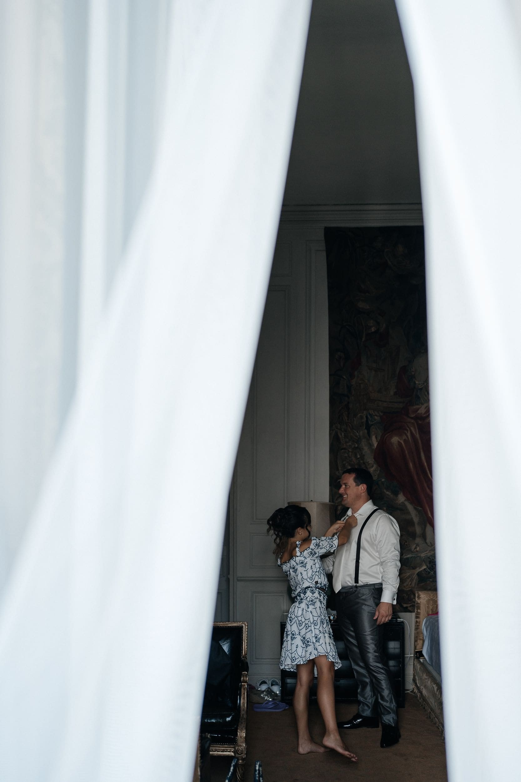 groom and sister preparing for a wedding