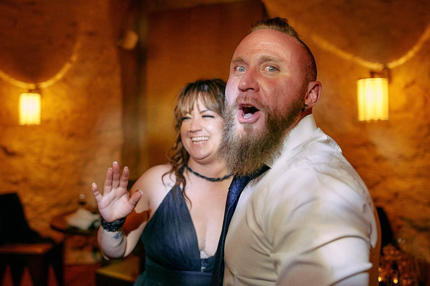 Guests enjoying late-night wedding atmosphere.