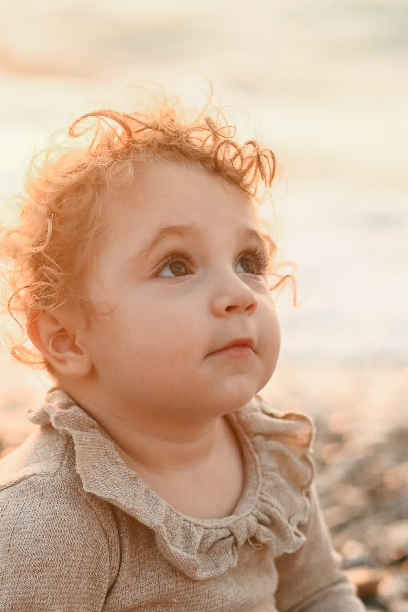 Happy family walking along a Rhodes beach at sunset. Photographer in Rhodes Island