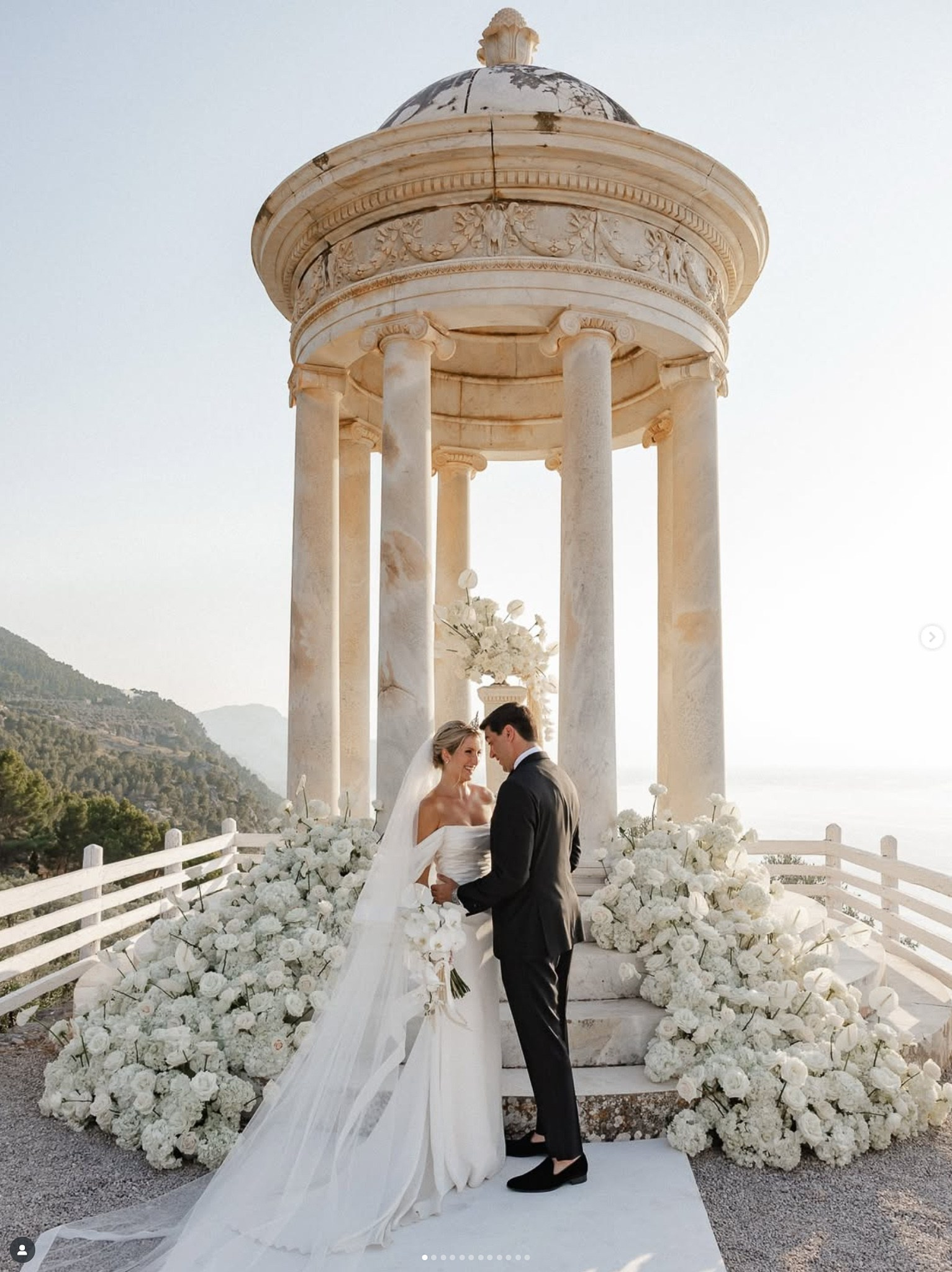 Bride and groom sharing an intimate moment at the Son Marroig temple after their wedding ceremony