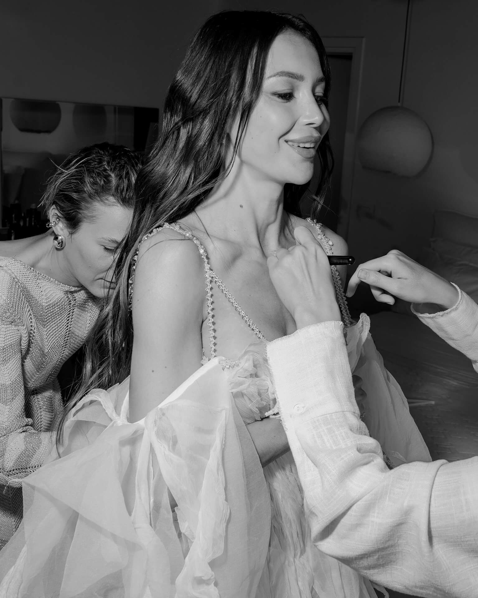 Bride getting ready indoors with stylist in Bellagio on Lake Como wedding