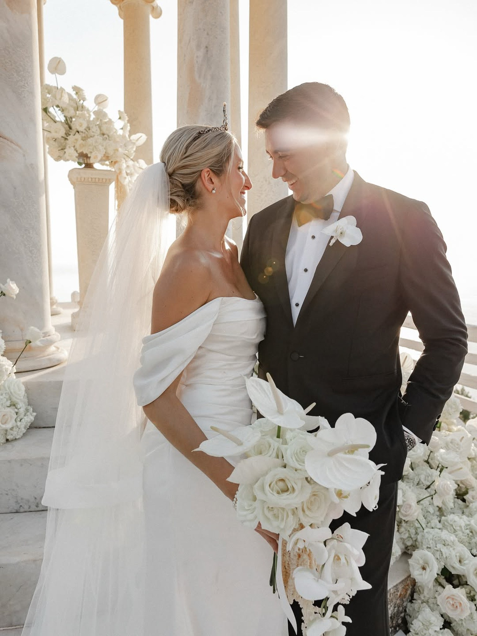 Bride and groom smiling closely together in golden sunlight at their Son Marroig wedding
