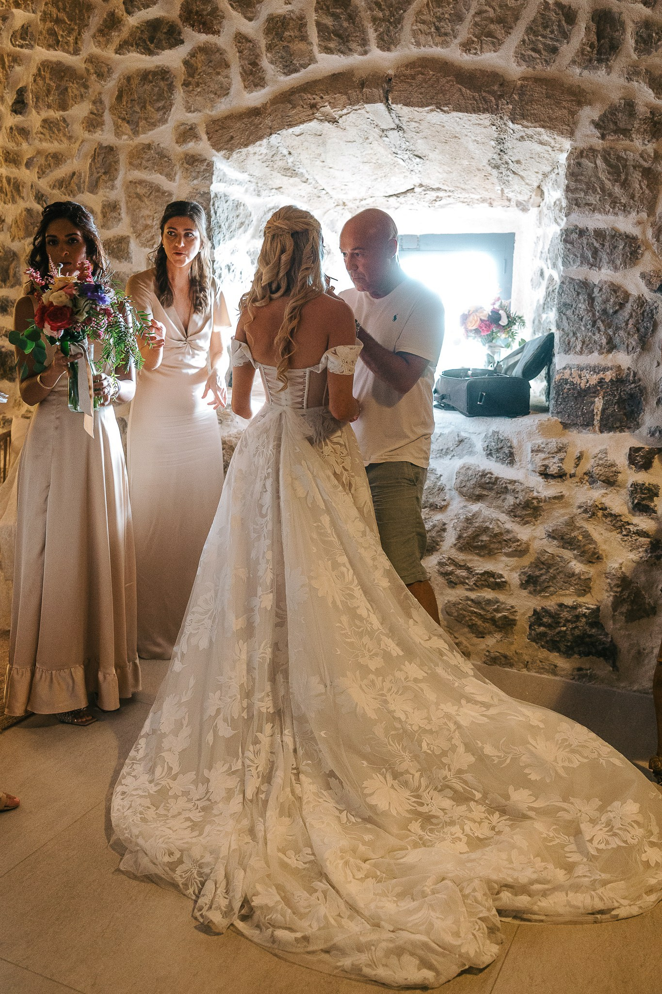 Bride and groom laughing and holding hands at their reception table at their Mallorca wedding