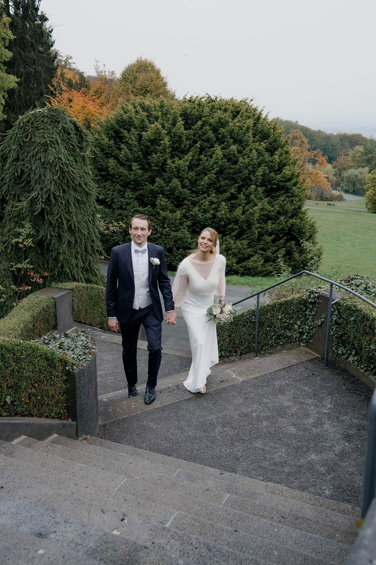 Newlyweds walking up steps, destination wedding at Falkenstein Grand