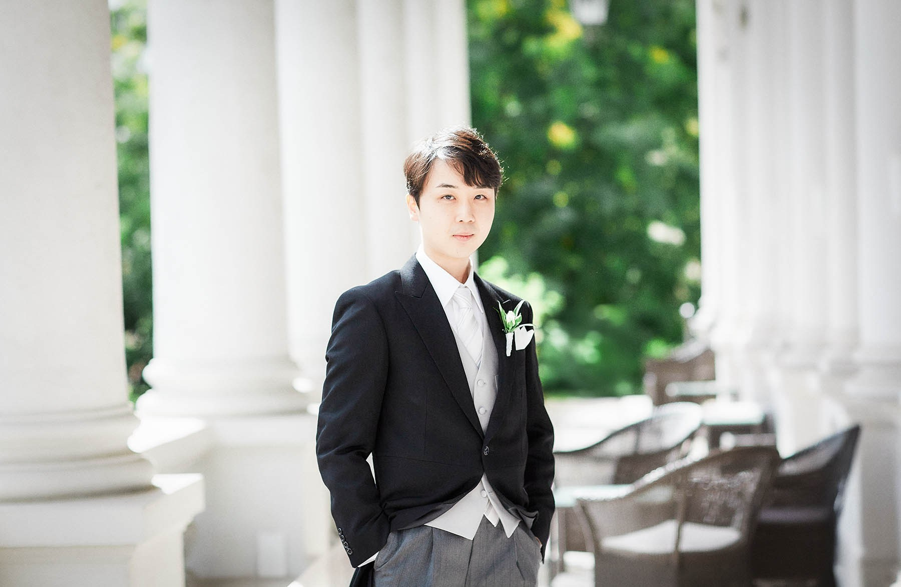 Groom portrait on balcony at Palais Coburg Vienna.