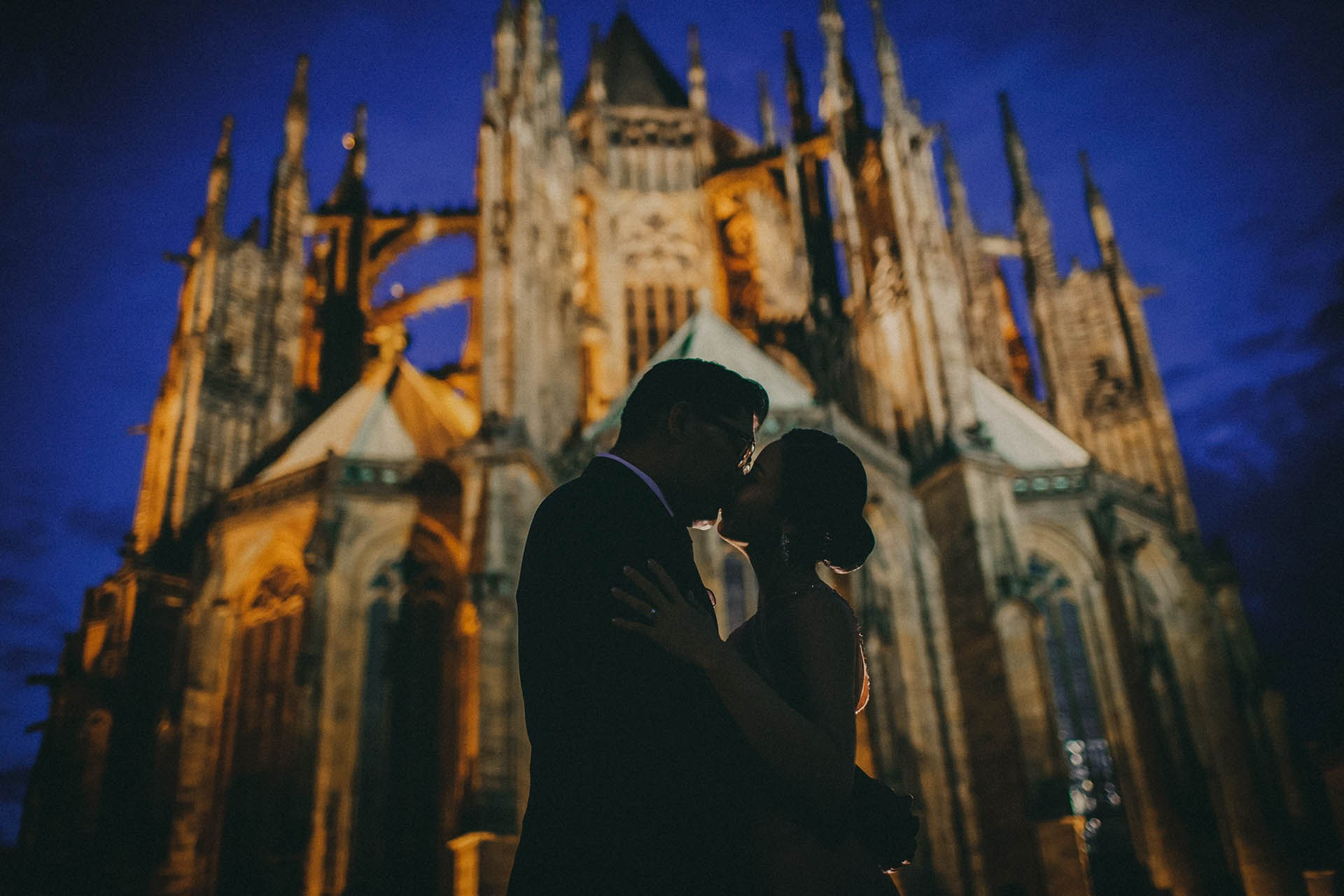 Catherine Cedric Son romantic kiss St. Vitus Cathedral Prague portrait.