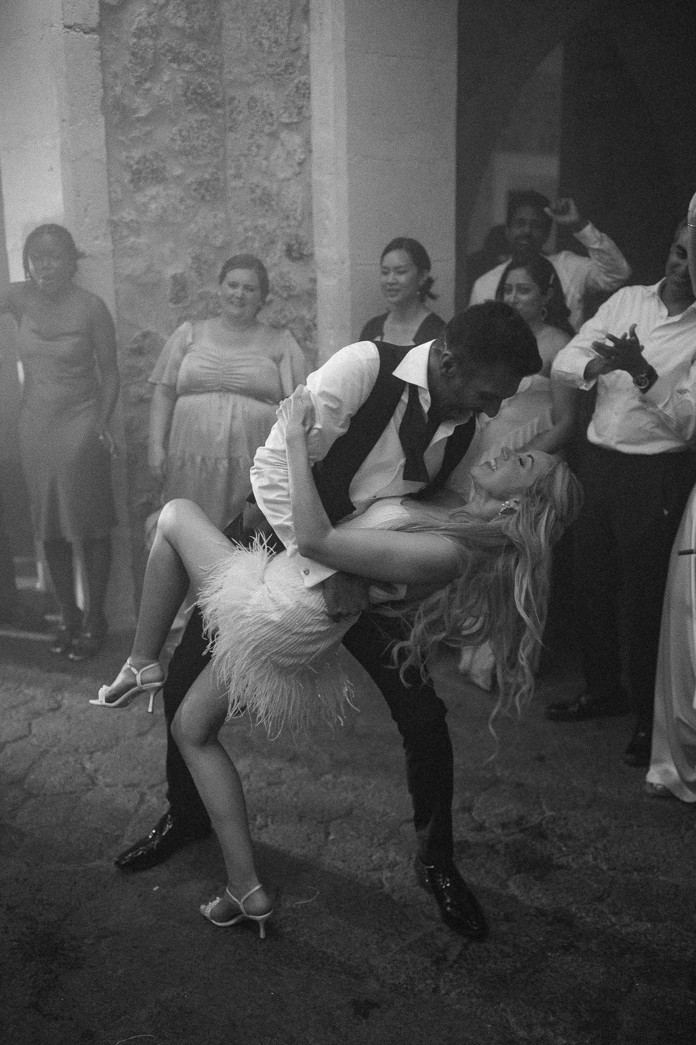 Black and white photo of bride and groom dancing together at their Mallorca wedding reception