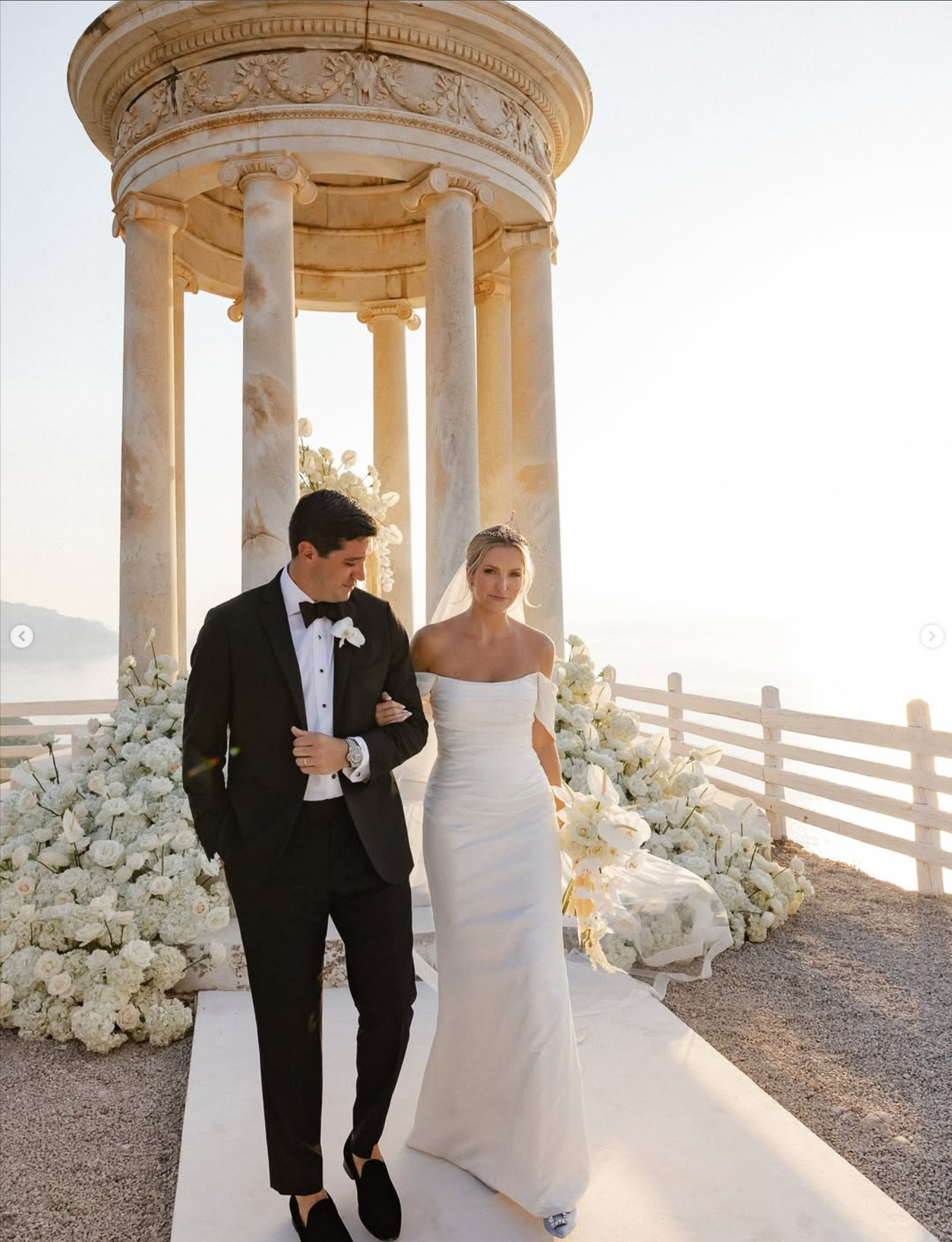 Bride and groom walking together after their ceremony at the Son Marroig temple