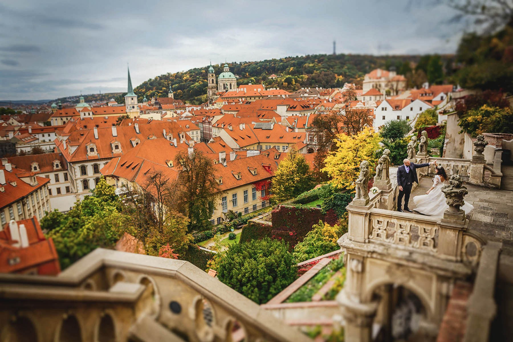 Newlyweds dance above Mala Strana from the top of the Royal Garden under Prague Castle.